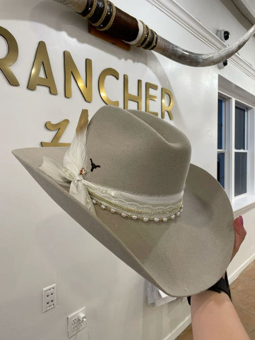 Custom gray rancher hat with pearl and lace bands at the Coastal Cowgirl hat bar in San Diego.